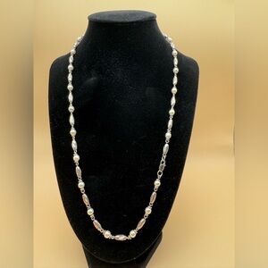 Silver and faux pearl necklace 22 inches with lobster clasp.